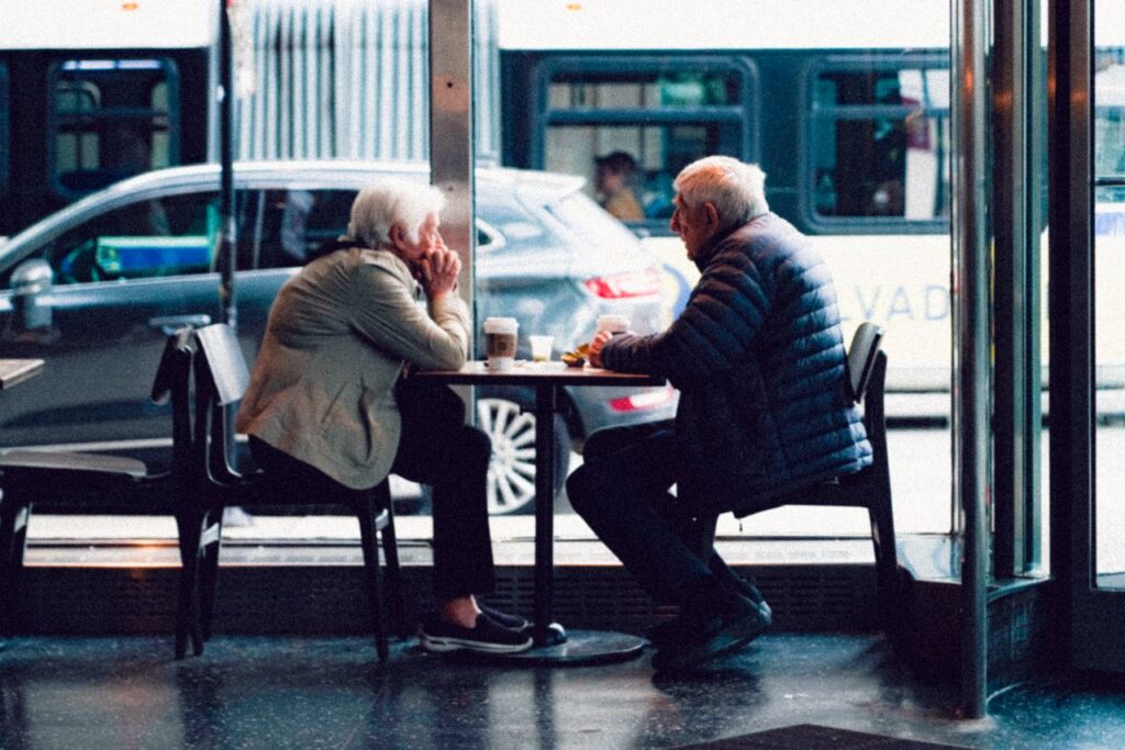 Older couple resting together in a café